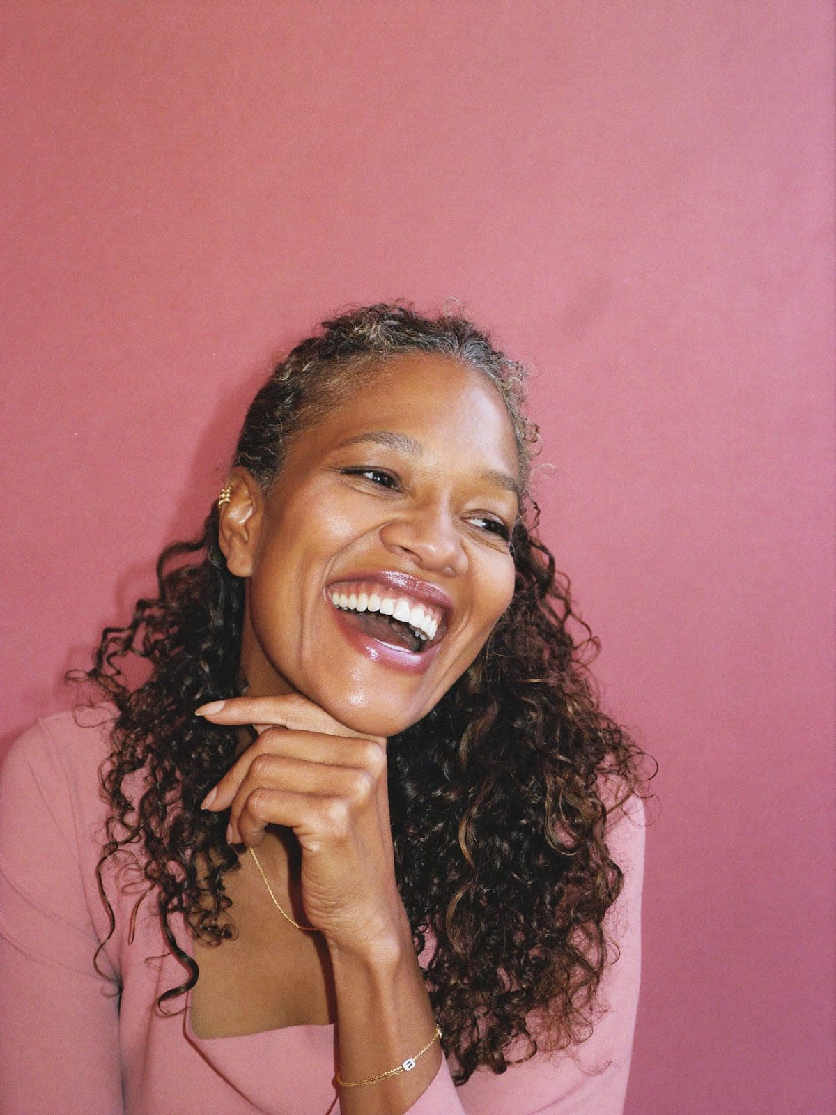 A woman in her forties, smiling